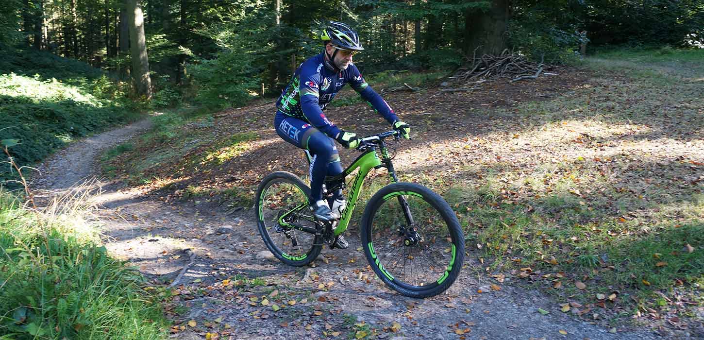 A person on a mountain bike in Nørreskoven Forest in Vejle
