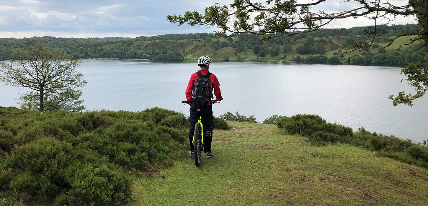 Mountain biker with a view of a lake