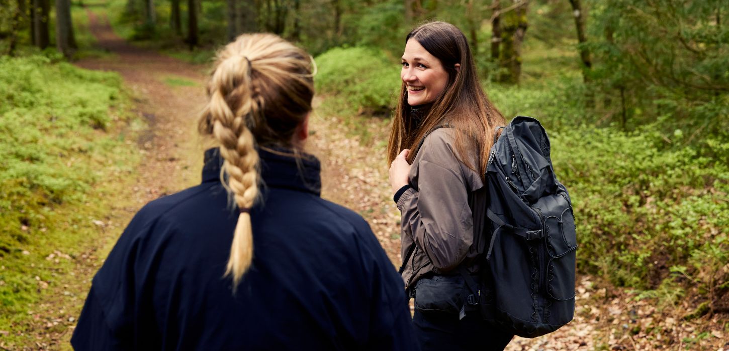 Two people are hiking along Hærvejen