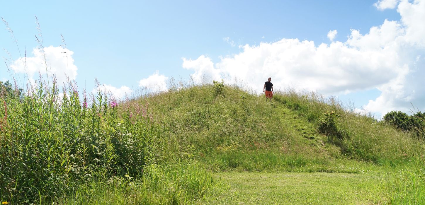 A person walks by The Grave of the Egtved Girl