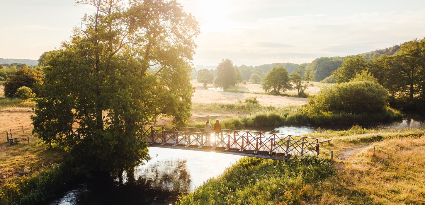 Two girls standing on a bridge in Vejle Ådal
